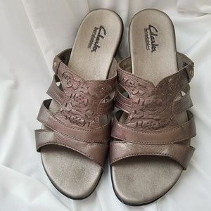 Clarks Bendable slip on sandals.